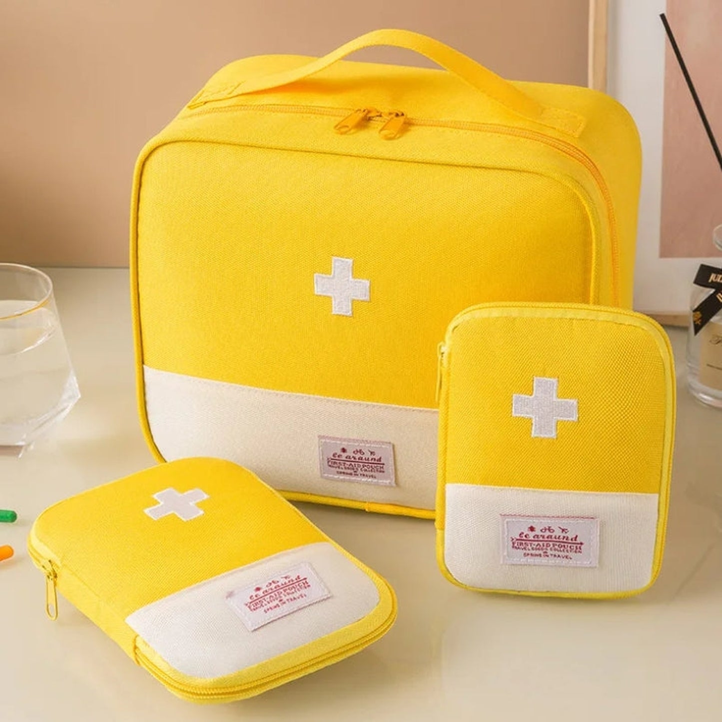 travel medication pouch three sizes visible - Yellow - Red - Pink - Blue