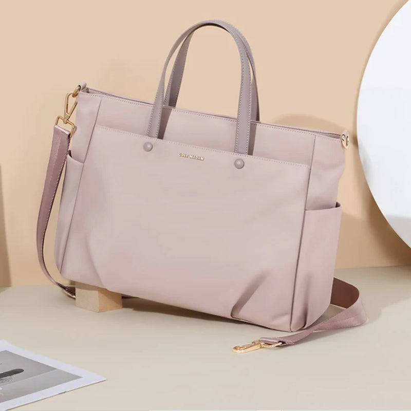 women's travel handbag close up on bag - Beige - Pink - Black