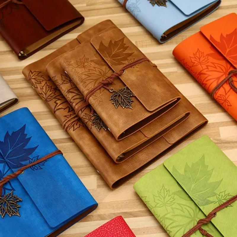 vintage travel notebook five items aligned - Light Brown - Dark Brown - Brown - Sky Blue - Blue - Orange - Light Green - Green - Pink - Perforated Leaves