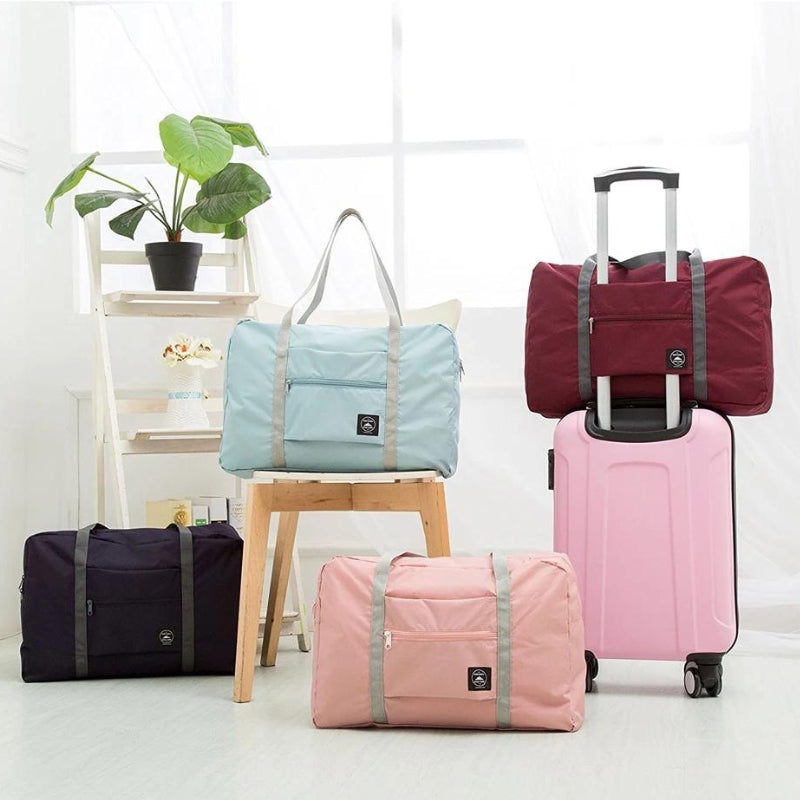 ultra lightweight foldable travel bag four bags visible - Dark blue - Red - Pink - Green
